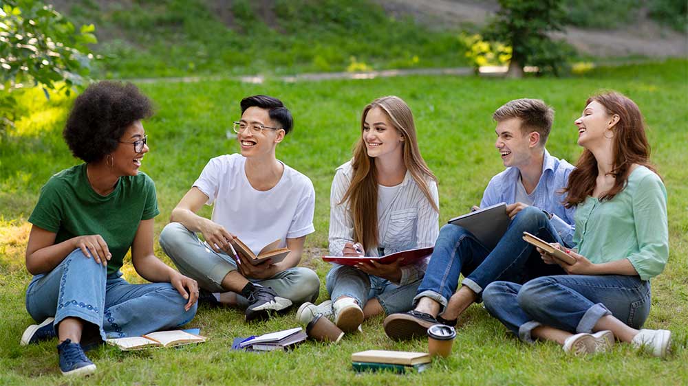 Teens chatting on the lawn